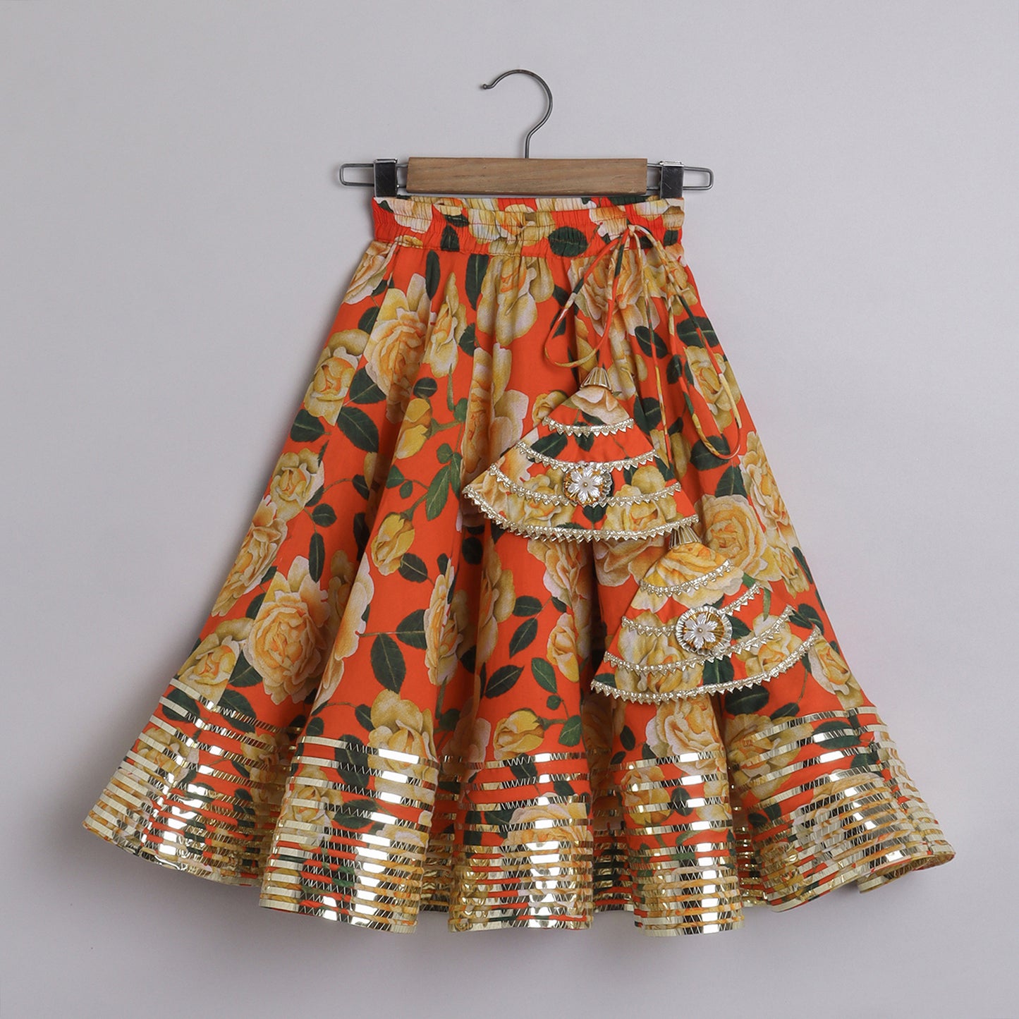 Metallic Lace Detailed Sleeveless Beige Top And Floral Printed Orange Lehenga