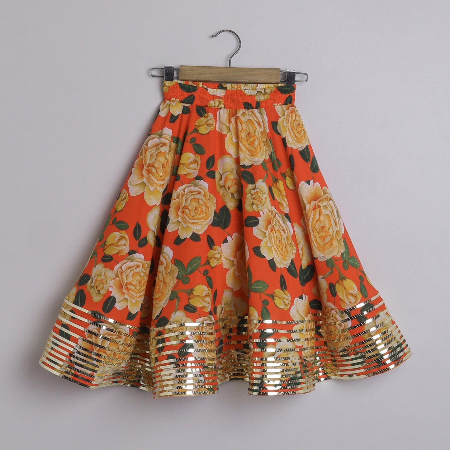 Metallic Lace Detailed Sleeveless Beige Top And Floral Printed Orange Lehenga