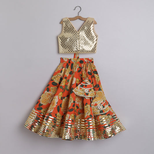 Metallic Lace Detailed Sleeveless Beige Top And Floral Printed Orange Lehenga