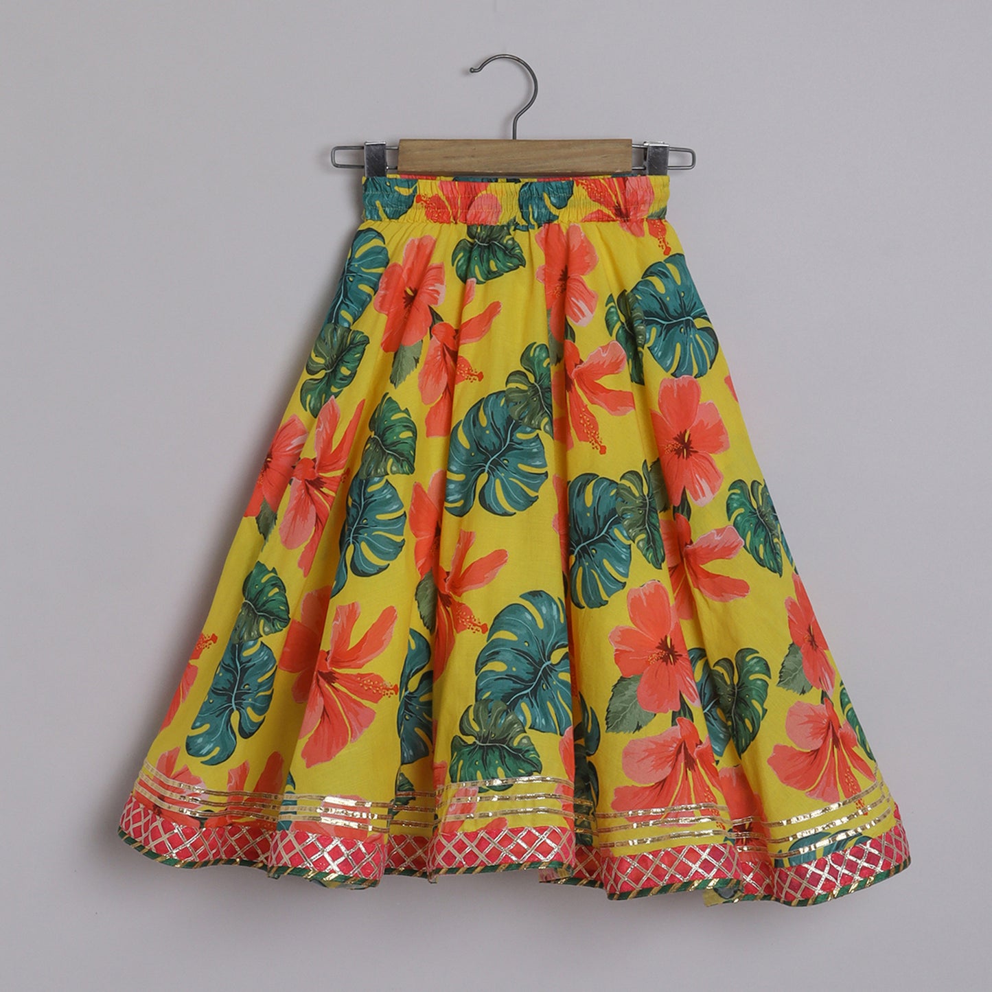 Girls Elegant Hibiscus Printed Yellow Cotton Top And Asymmetric Lehenga